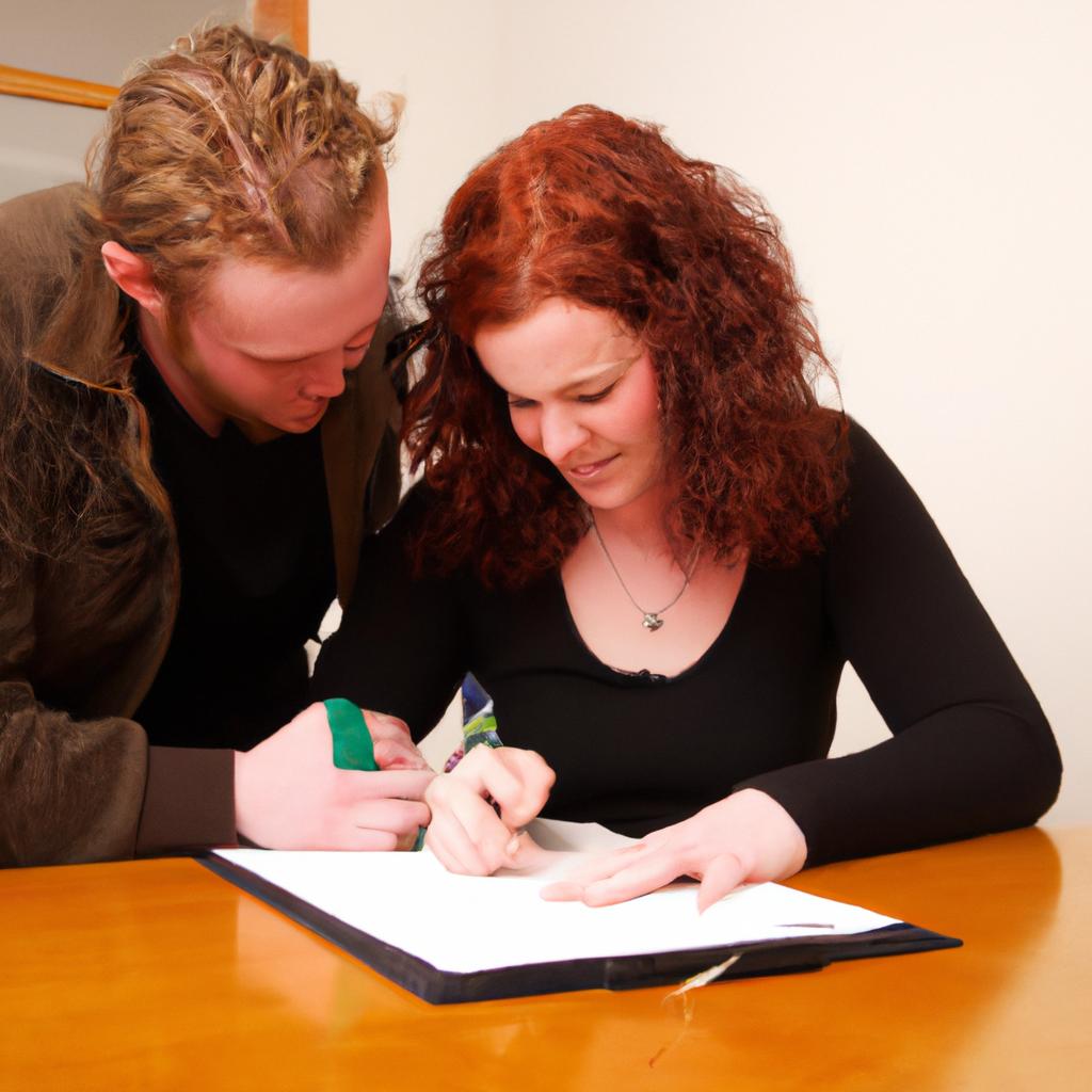 Couple signing mortgage paperwork together