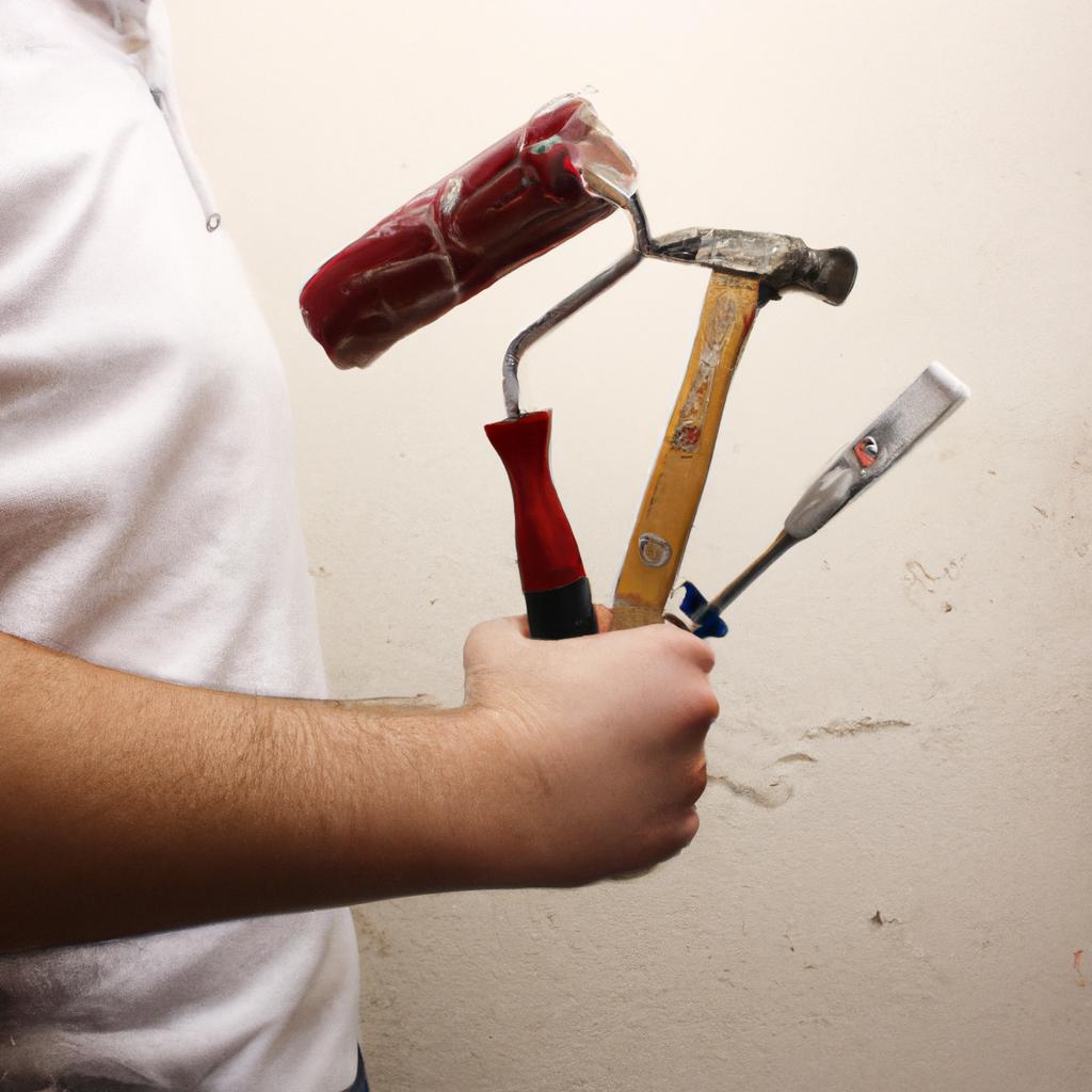 Person holding house renovation tools