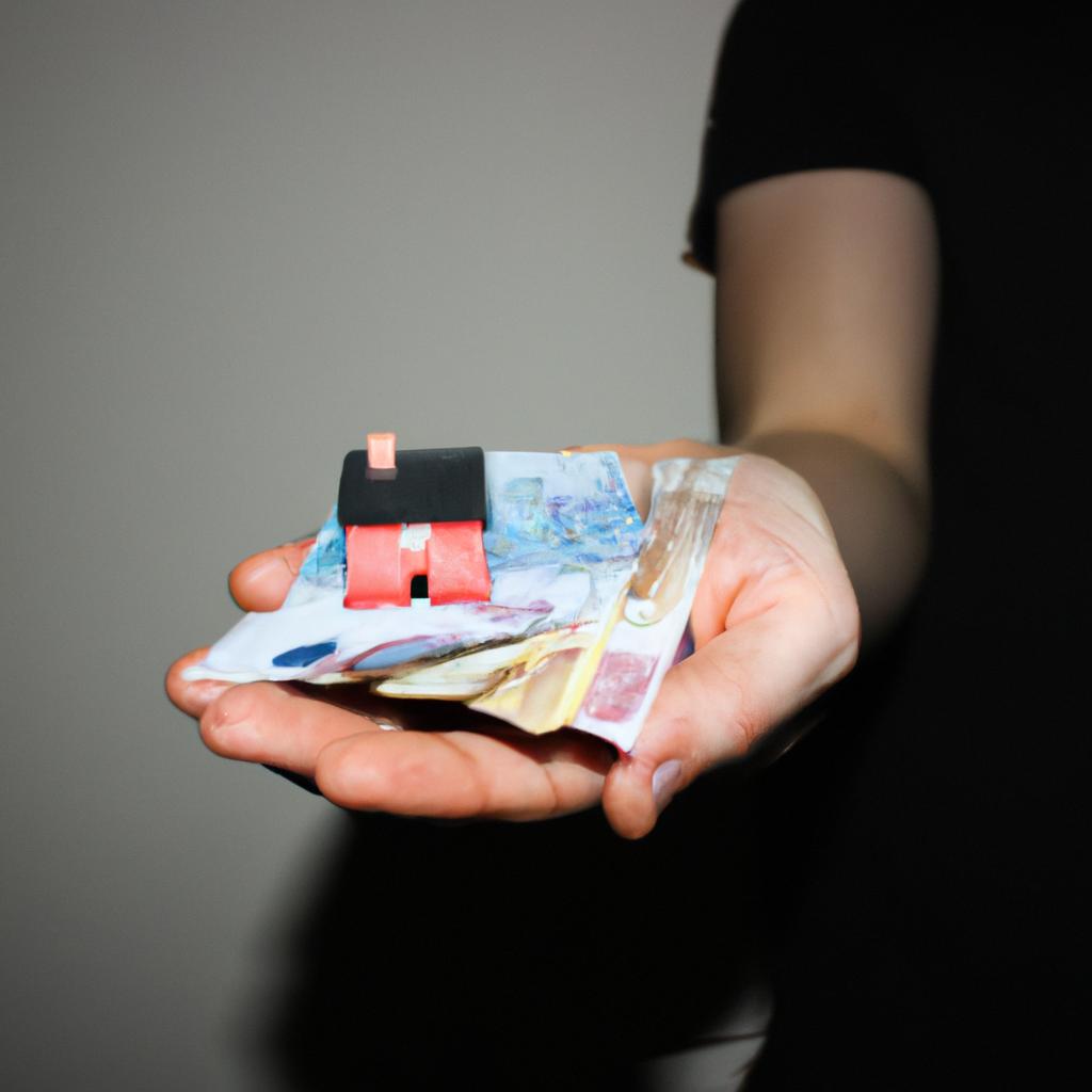 Person holding house and money